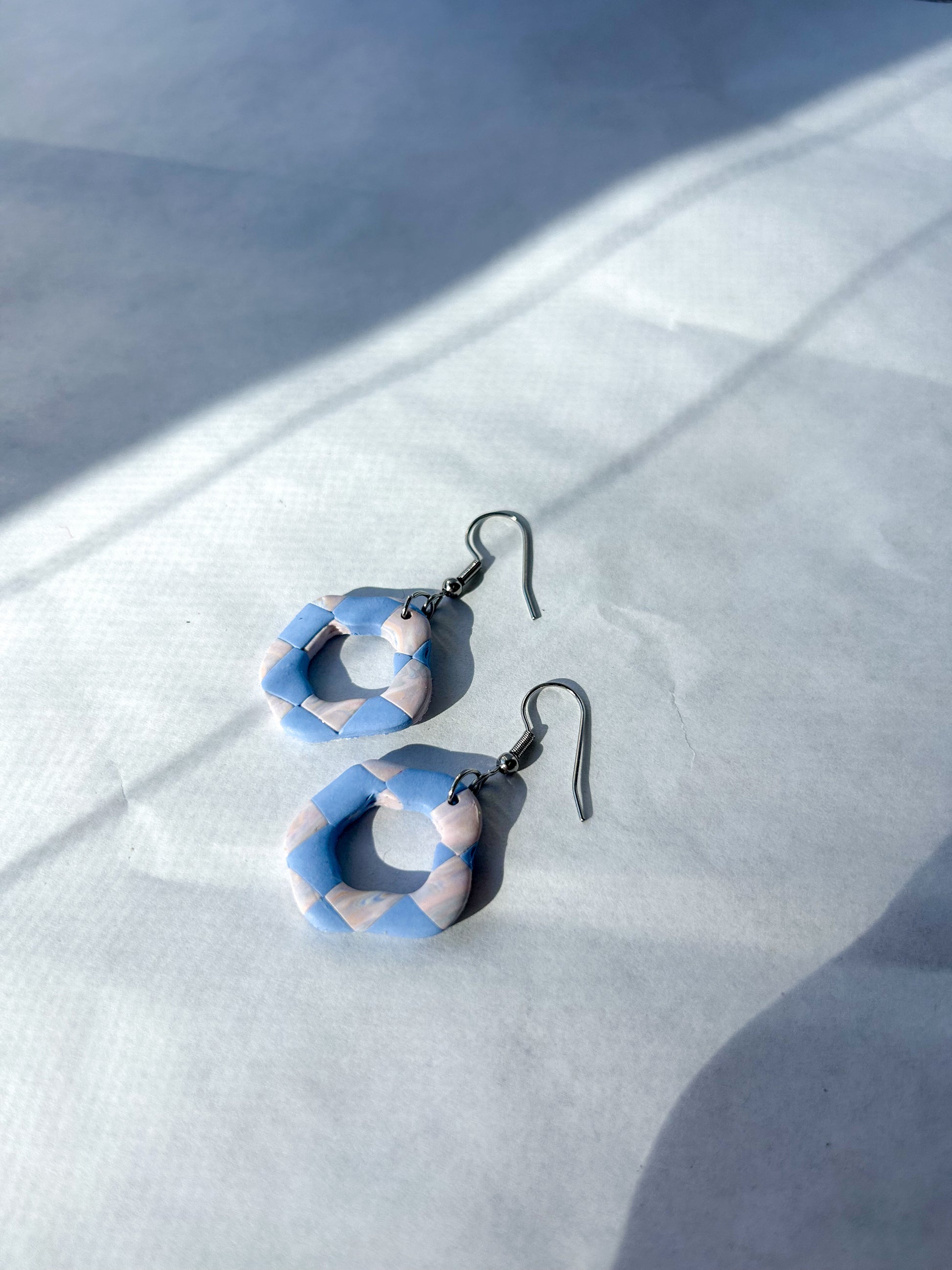 Earrings laying on a flat surface